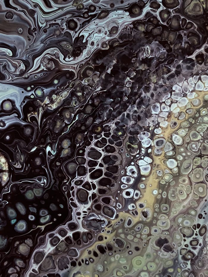 Fluid art piece featuring intricate dark and light swirls resembling natural textures. Ideal for modern decor.